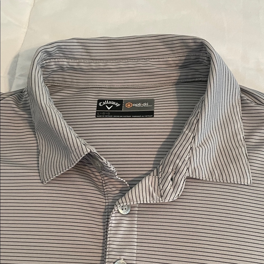 Callaway Men's gray polo shirt with black stripes.  Excellent condition.